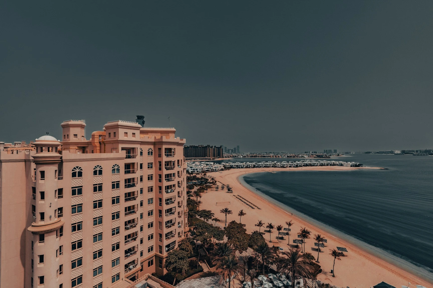 An aerial view of a beach and a hotel in Dubai