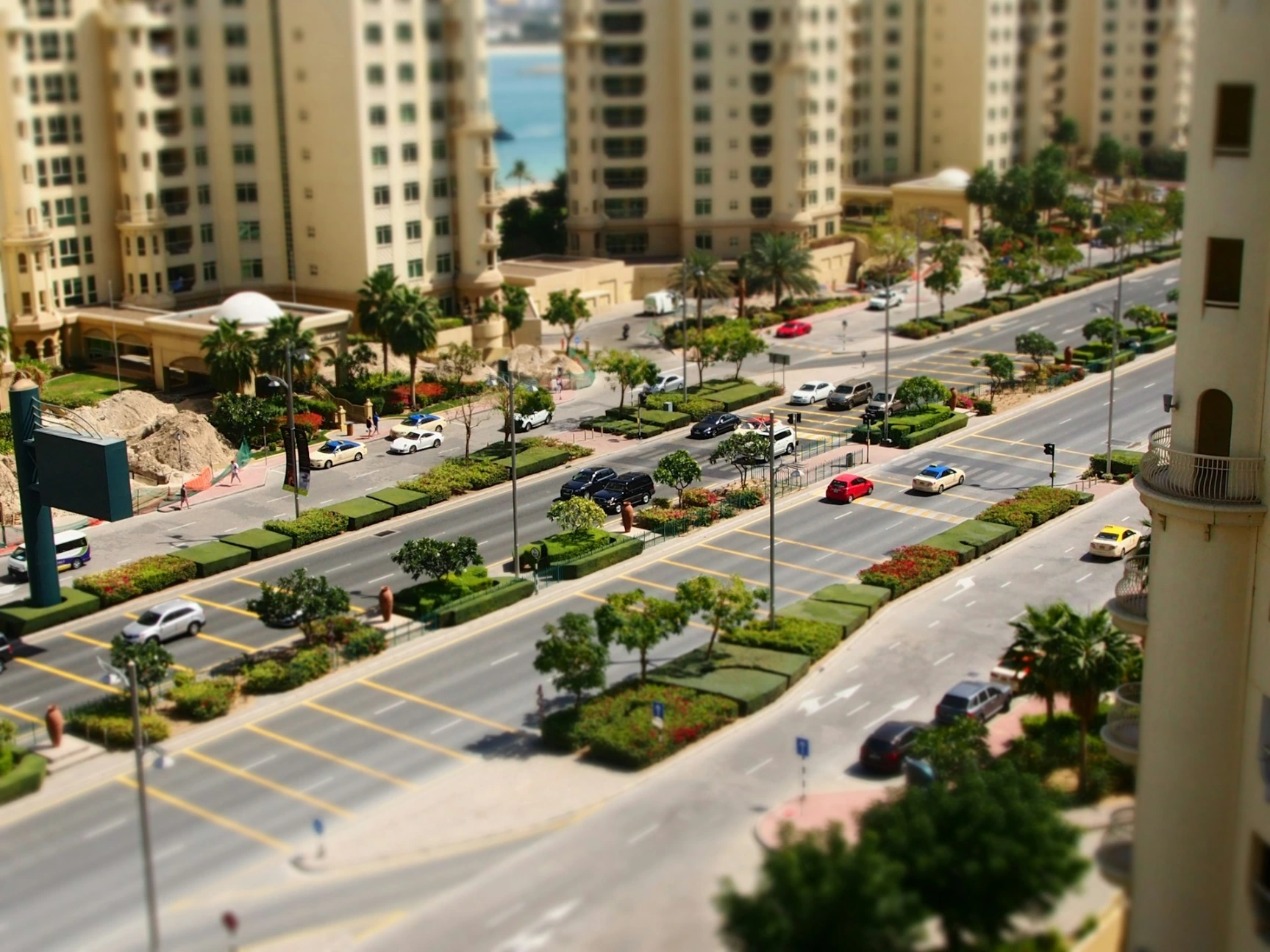 a city street filled with lots of traffic next to tall buildings at Palm Jumeirah Dubai